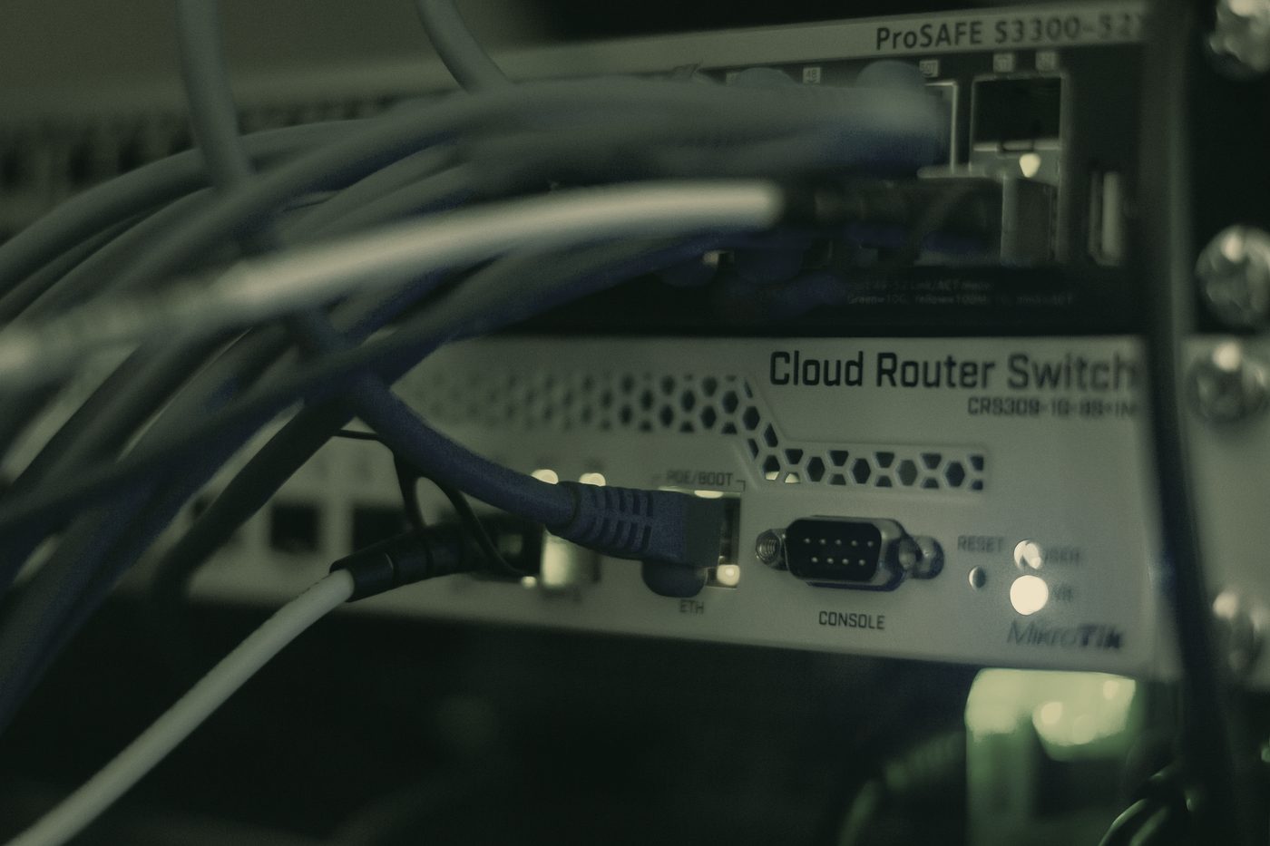 Network switch with patch cables running into it.